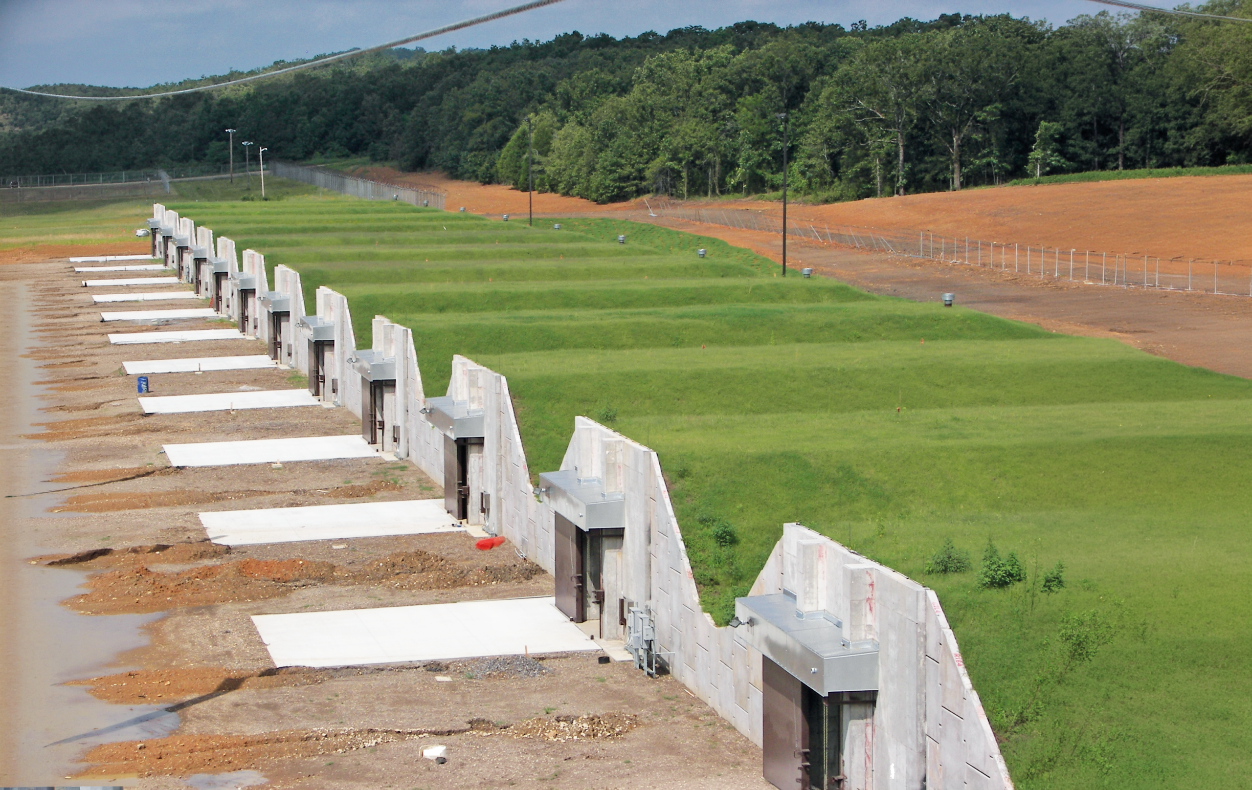 Precast segmental concrete earth‑covered storage structures.